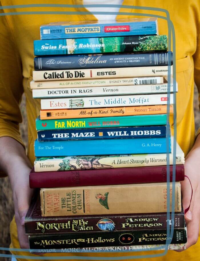 Stack of books held by person