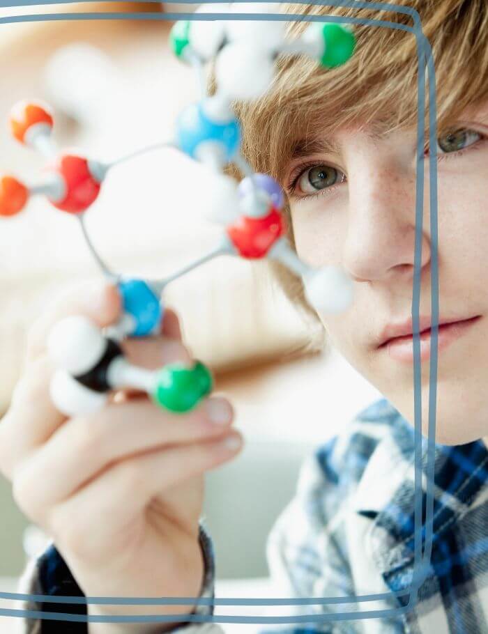 Middle School Boy with science structure