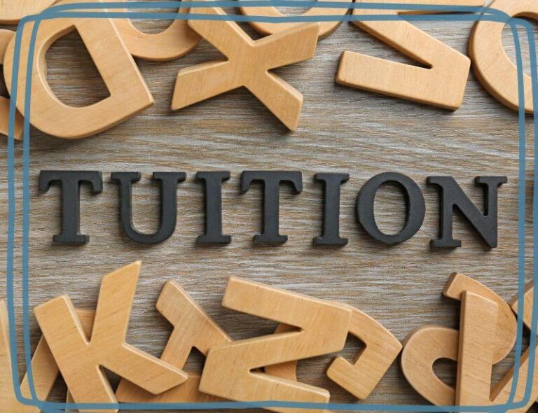 Image of the word "tuition" in wood letters for the TEACH Cleburne tuition page
