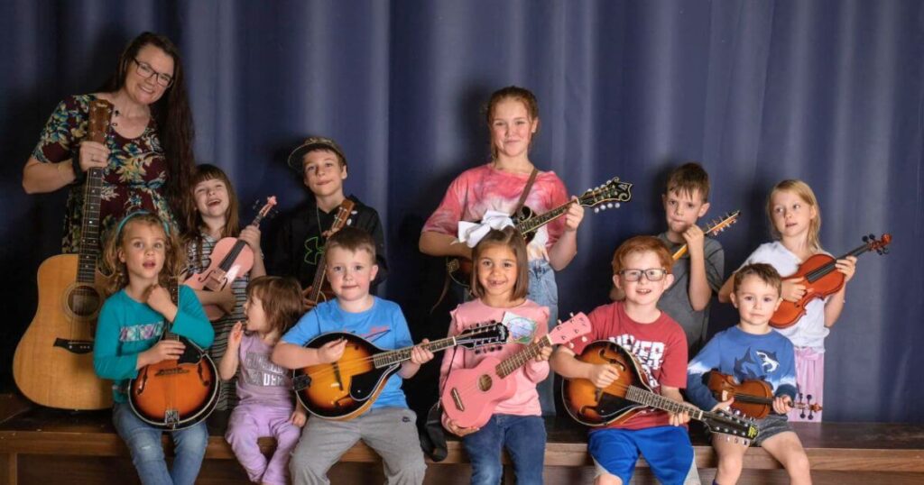 Class picture of elementary homeschool music students and teacher