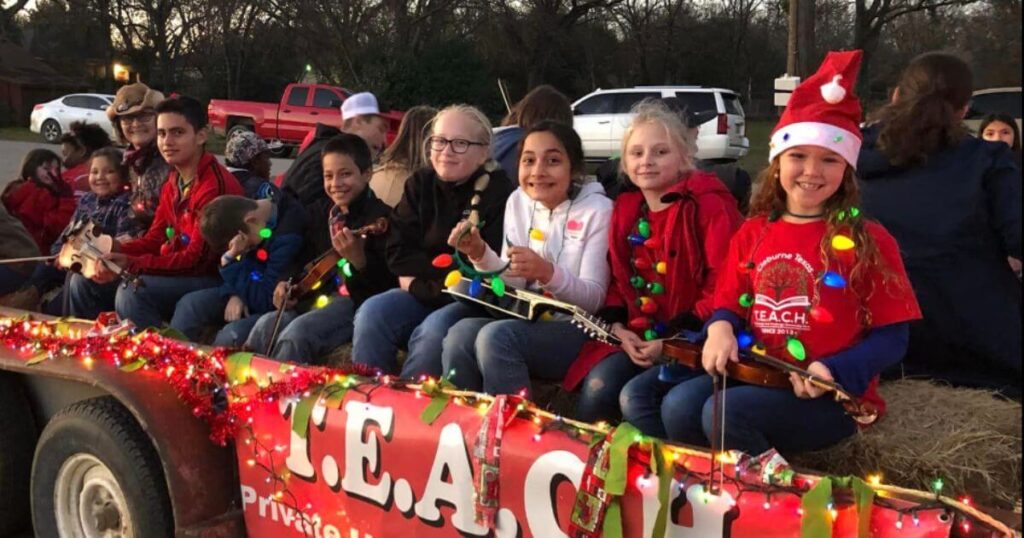 Group of homeschool music students in Christmas Parade on float